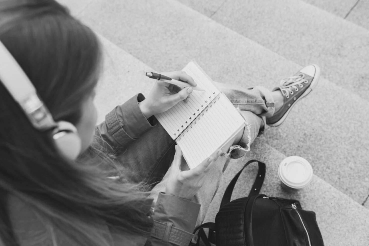 Person organizing financial documents and preparing for budgeting
